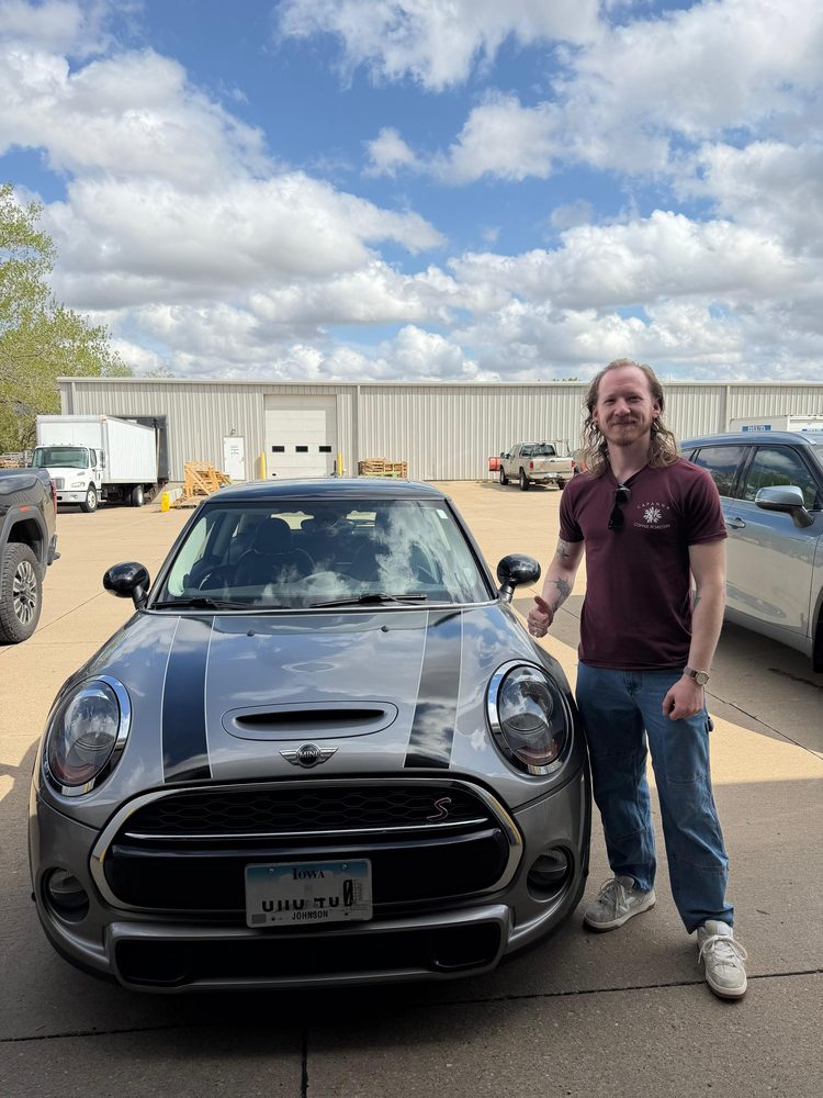 Chris with his restored Mini Cooper